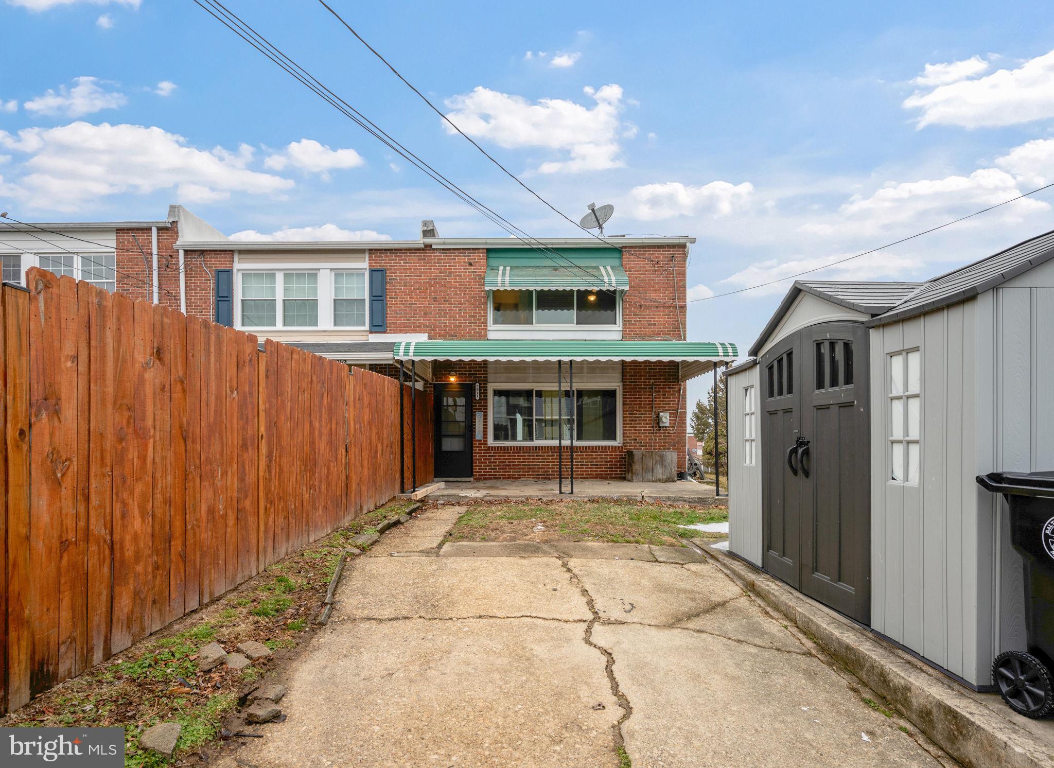 7911 Bank Street Baltimore, MD 21224 - Photo 30 of 40 a view of a porch with a refrigerator and a fireplace