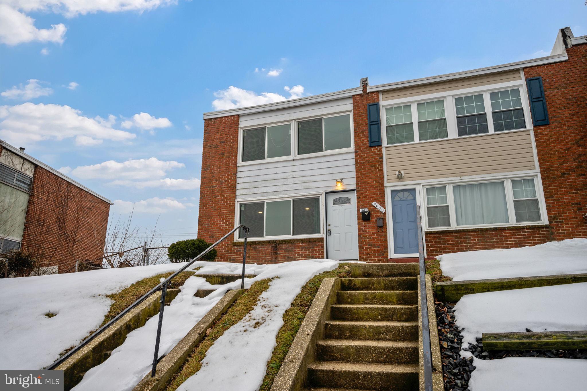 7911 Bank Street Baltimore, MD 21224 - Photo 32 of 40 a front view of a house with a yard