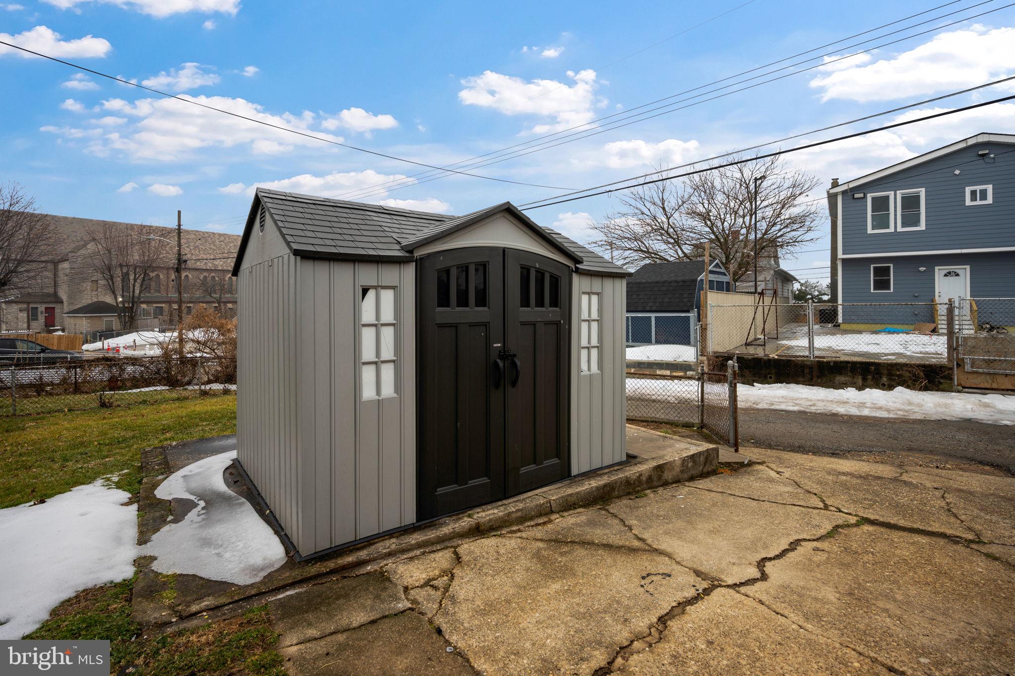 7911 Bank Street Baltimore, MD 21224 - Photo 34 of 40 a front view of a house with a yard