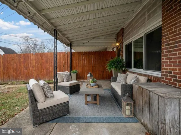 a outdoor space with patio the couches and a potted plant with the view of garden