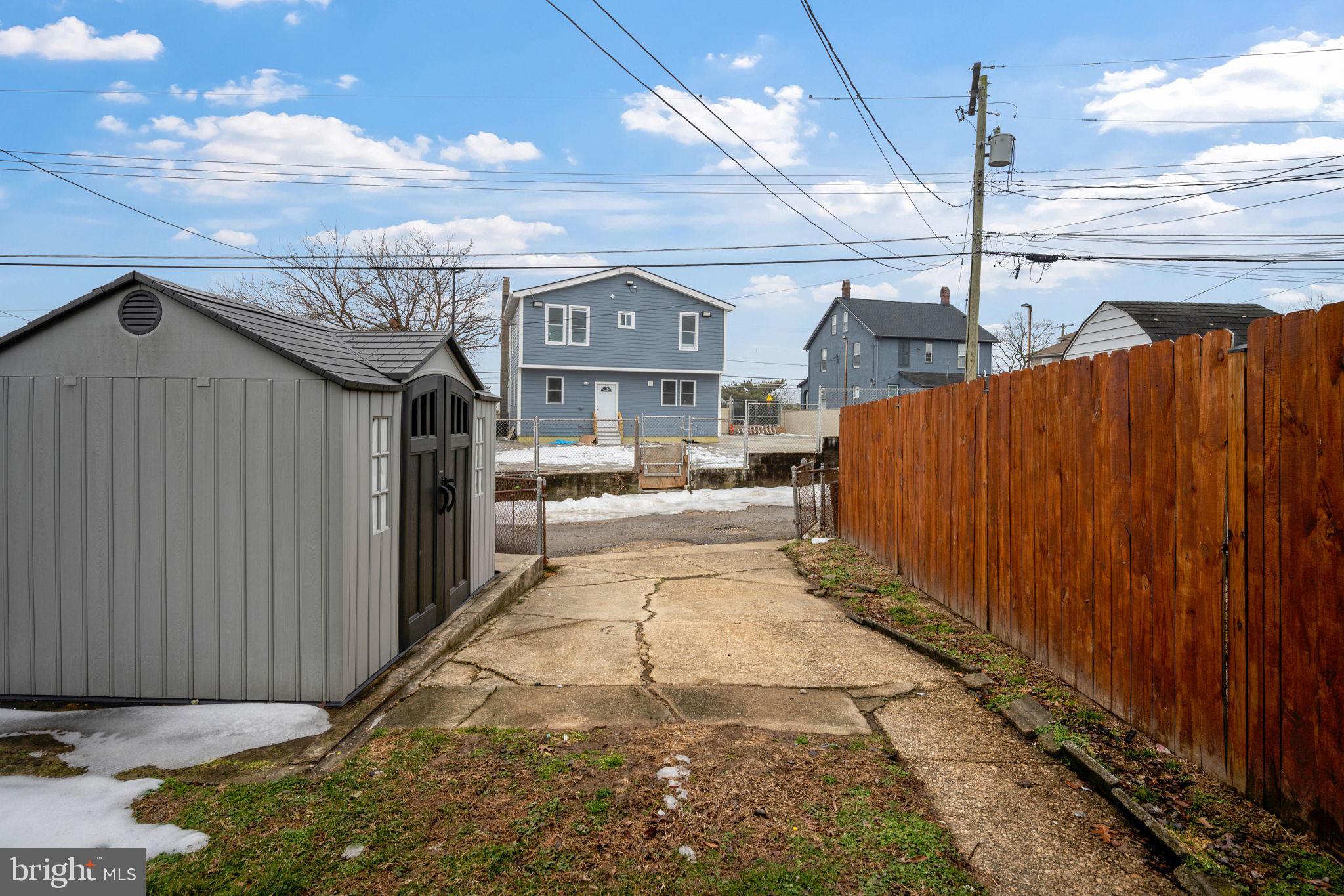 7911 Bank Street Baltimore, MD 21224 - Photo 39 of 40 a view of a street with wooden fence