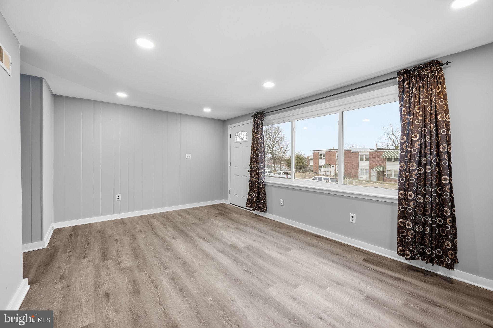 7911 Bank Street Baltimore, MD 21224 - Photo 7 of 40 a view of an empty room with a window