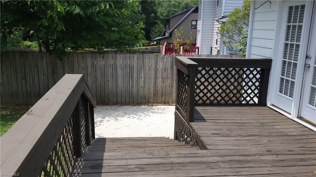 3712 Sutton Way High Point, NC 27265 - Photo 18 of 18 The deck has two sets of steps, one to the back yard and one set to the concrete pad.