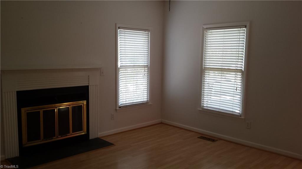 3712 Sutton Way High Point, NC 27265 - Photo 4 of 18 Another view of the living room showing both windows. This house is very light and bright!
