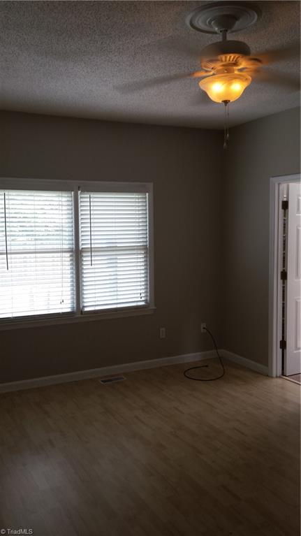 3712 Sutton Way High Point, NC 27265 - Photo 9 of 18 Master bedroom with double windows and sugar maple laminate flooring.