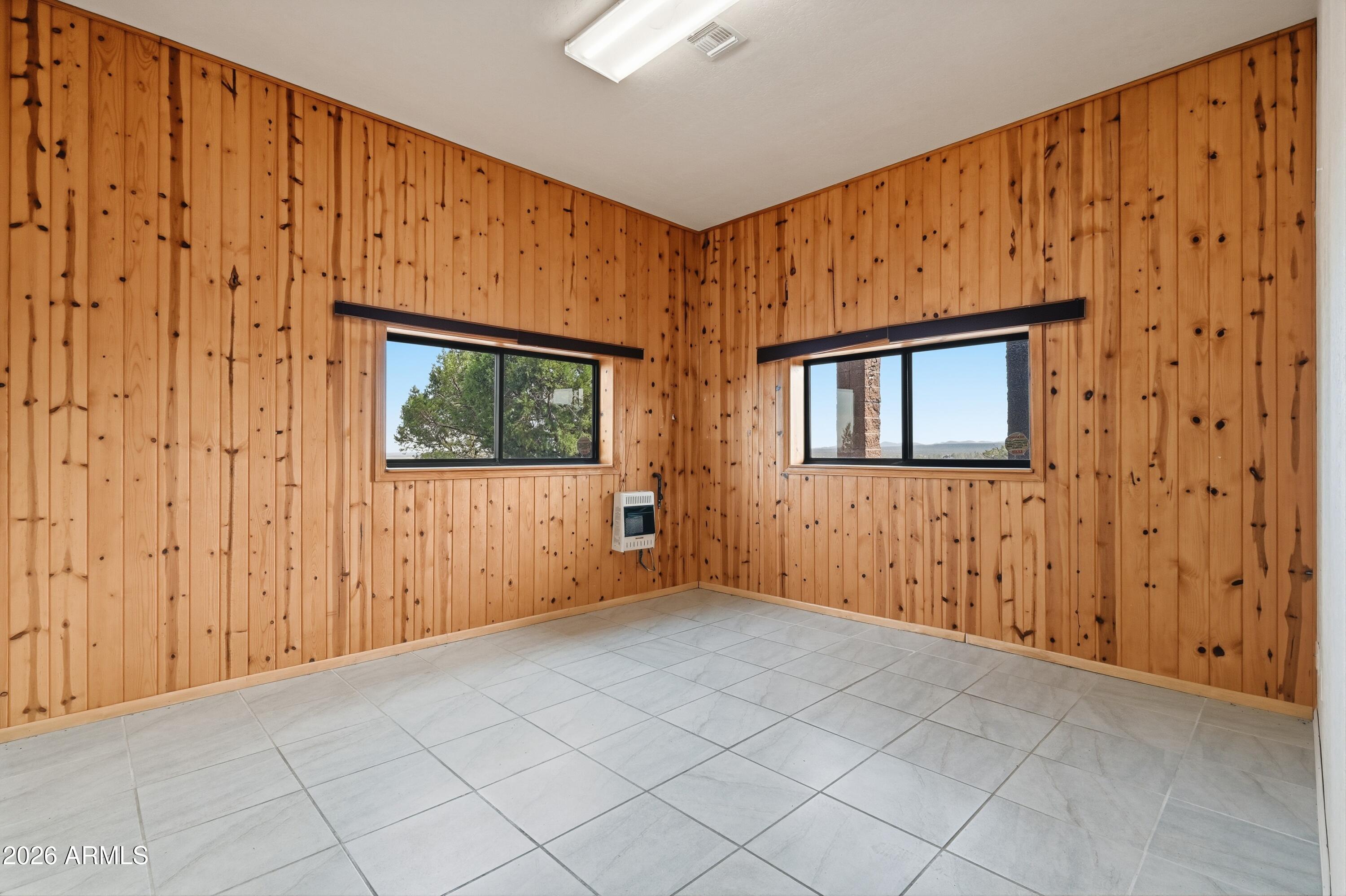 1561 South Canyon Ridge Trail Show Low, AZ 85901 - Photo 47 of 61 a view of an empty room with wooden wall