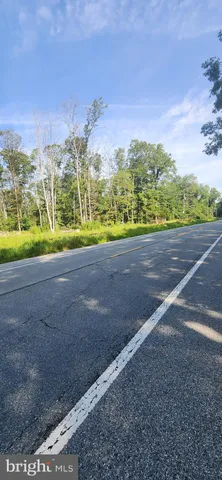a view of a road with an ocean view