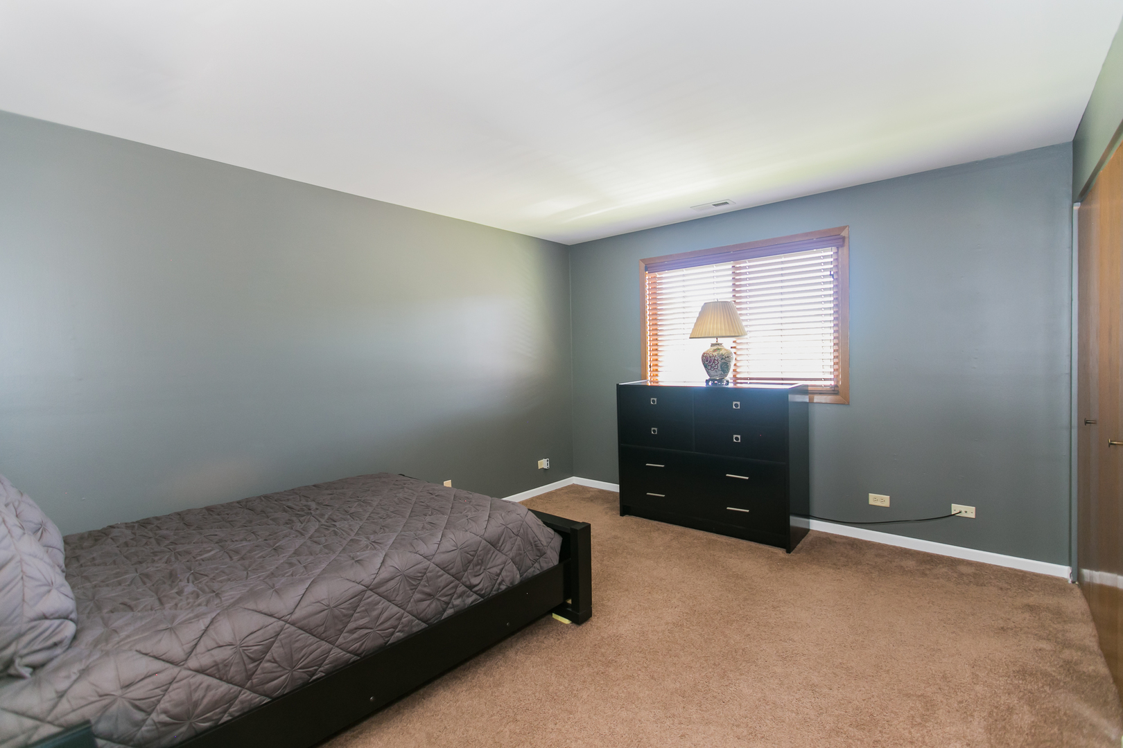 1903 West Golf Road, Unit 2A Mount Prospect, IL 60056 - Photo 11 of 20 a bedroom with a bed and window