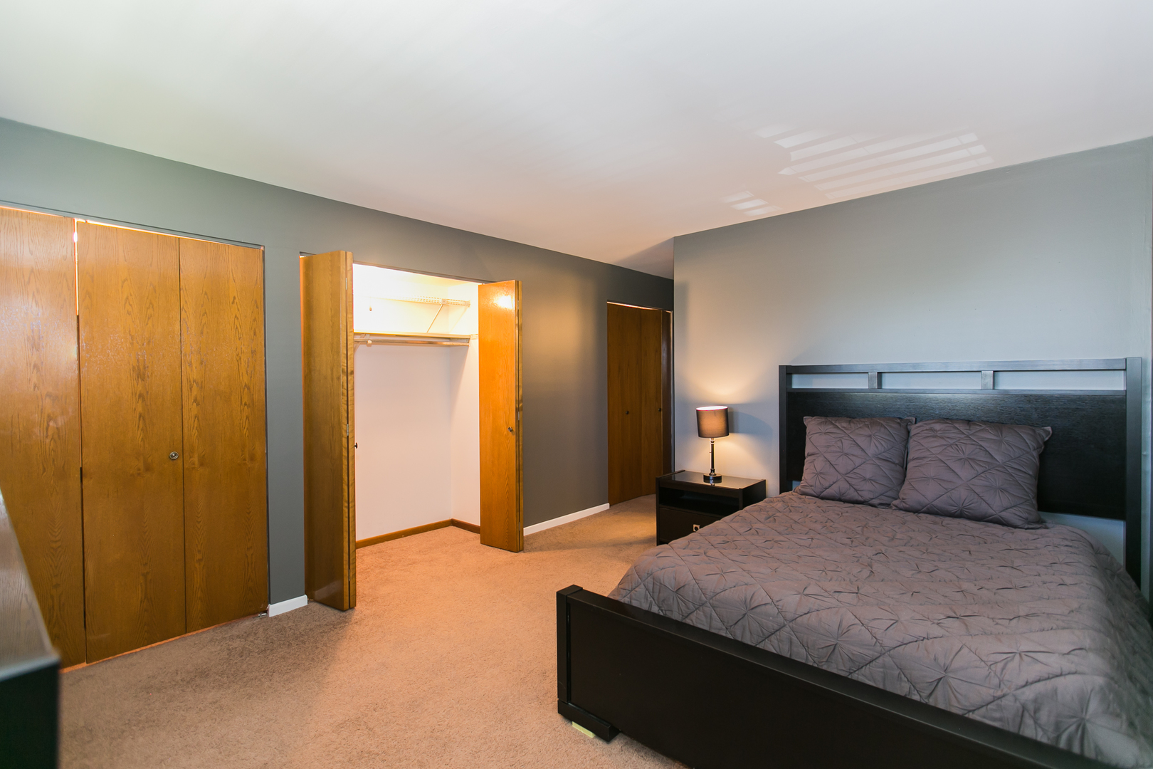 1903 West Golf Road, Unit 2A Mount Prospect, IL 60056 - Photo 12 of 20 a bedroom with a bed and window
