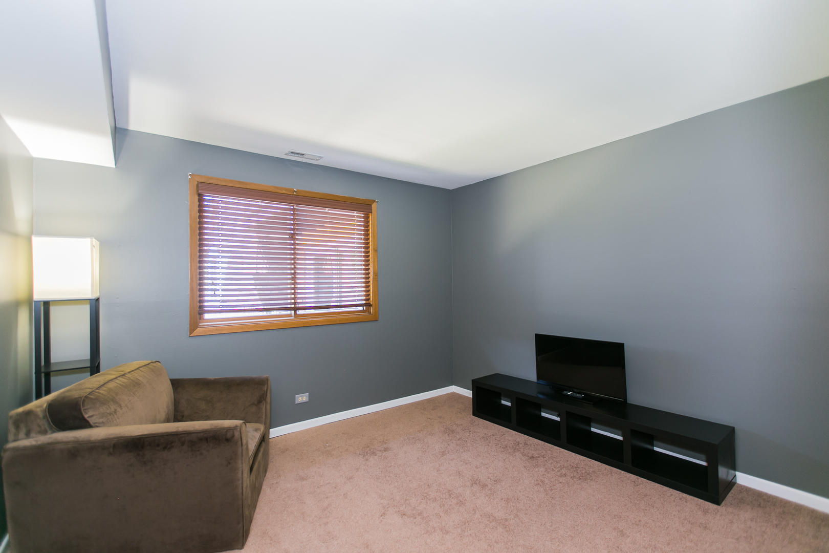 1903 West Golf Road, Unit 2A Mount Prospect, IL 60056 - Photo 15 of 20 a bedroom with a bed and a television