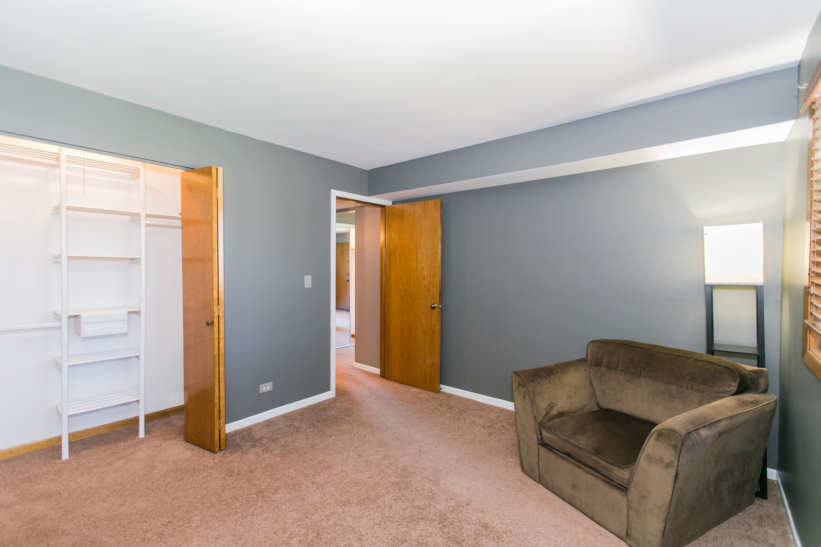 1903 West Golf Road, Unit 2A Mount Prospect, IL 60056 - Photo 16 of 20 a living room with furniture and a window