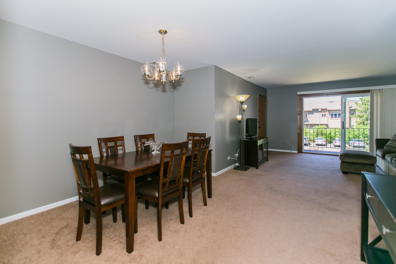 1903 West Golf Road, Unit 2A Mount Prospect, IL 60056 - Photo 6 of 20 a view of a dining room with furniture window and outside view