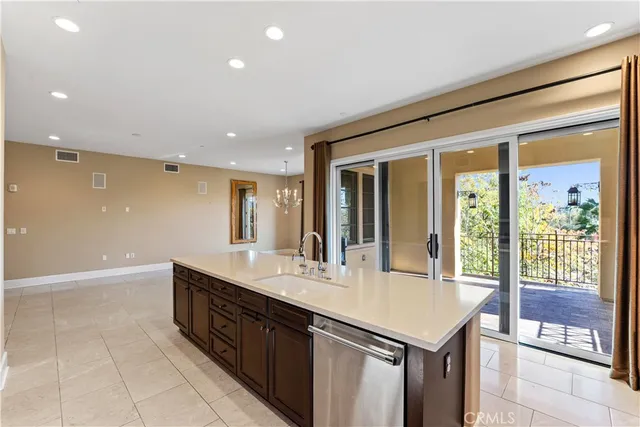 a kitchen with a sink and large window