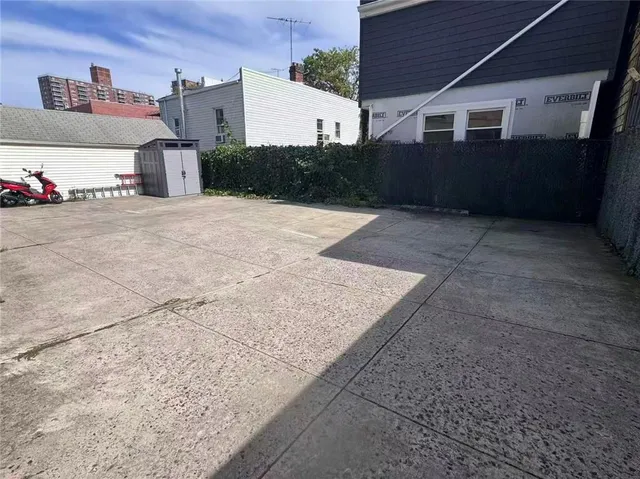 a view of a house with a street
