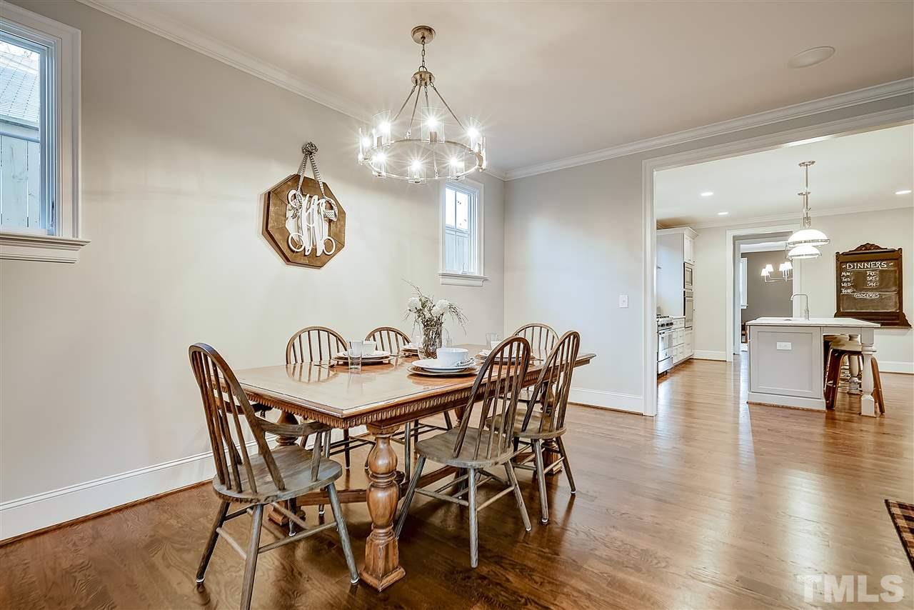 217 Georgetown Road Raleigh, NC 27608 - Photo 12 of 25 a view of a dining room with furniture window and wooden floor