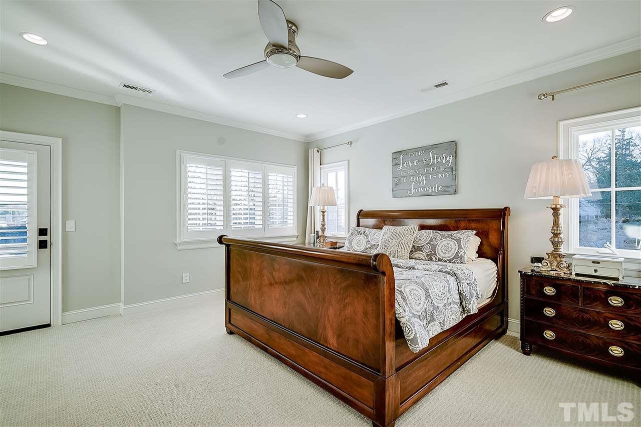 217 Georgetown Road Raleigh, NC 27608 - Photo 14 of 25 a bed room with a bed and a window