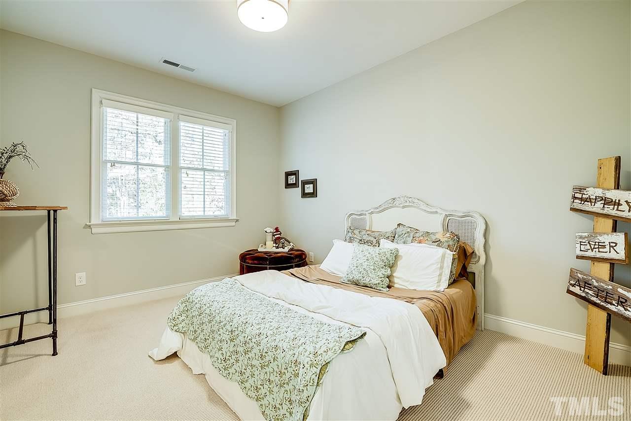 217 Georgetown Road Raleigh, NC 27608 - Photo 17 of 25 a bedroom with a bed and a window