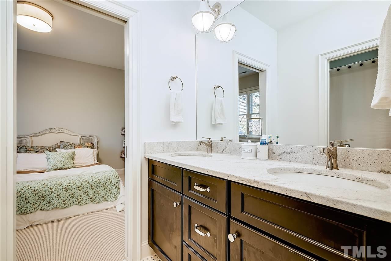 217 Georgetown Road Raleigh, NC 27608 - Photo 18 of 25 a bathroom with a granite countertop sink and a mirror