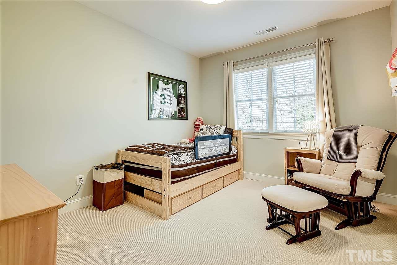 217 Georgetown Road Raleigh, NC 27608 - Photo 20 of 25 a bedroom with furniture and a window