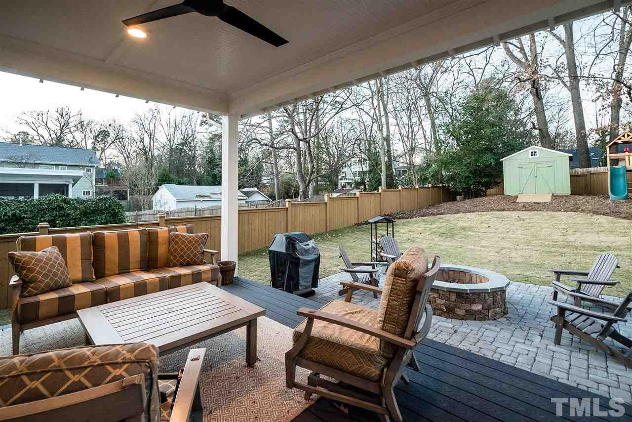 217 Georgetown Road Raleigh, NC 27608 - Photo 23 of 25 a view of a patio with a dining table and chairs with wooden floor
