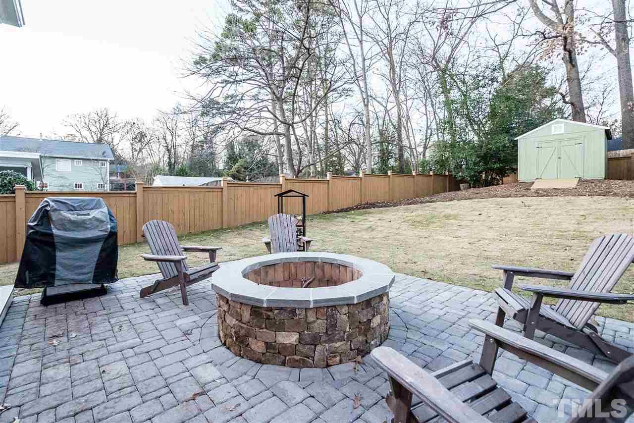 217 Georgetown Road Raleigh, NC 27608 - Photo 25 of 25 a view of a patio with a dining table and chairs with two chairs