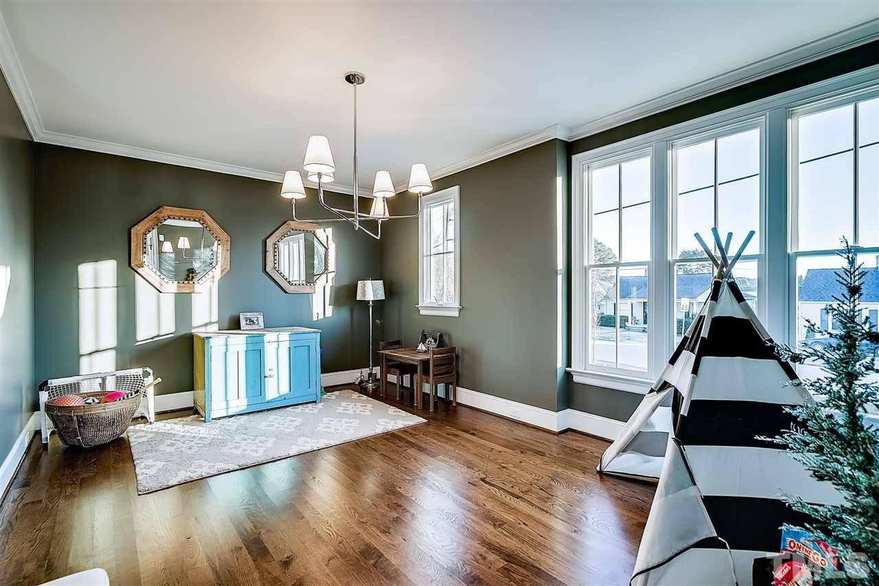 217 Georgetown Road Raleigh, NC 27608 - Photo 5 of 25 a living room with fireplace furniture and a large window