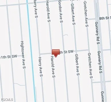 a view of a kitchen with cabinets and a window