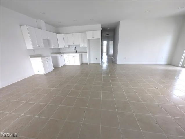 a view of a kitchen with a sink cabinets and a window