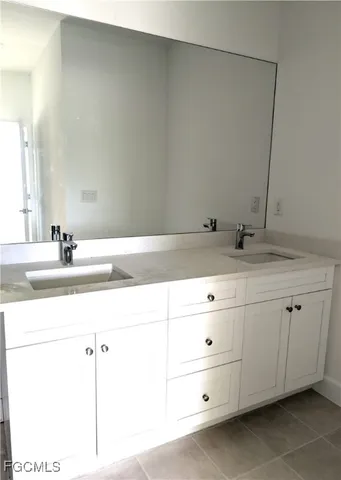 a white toilet sitting next to a shower