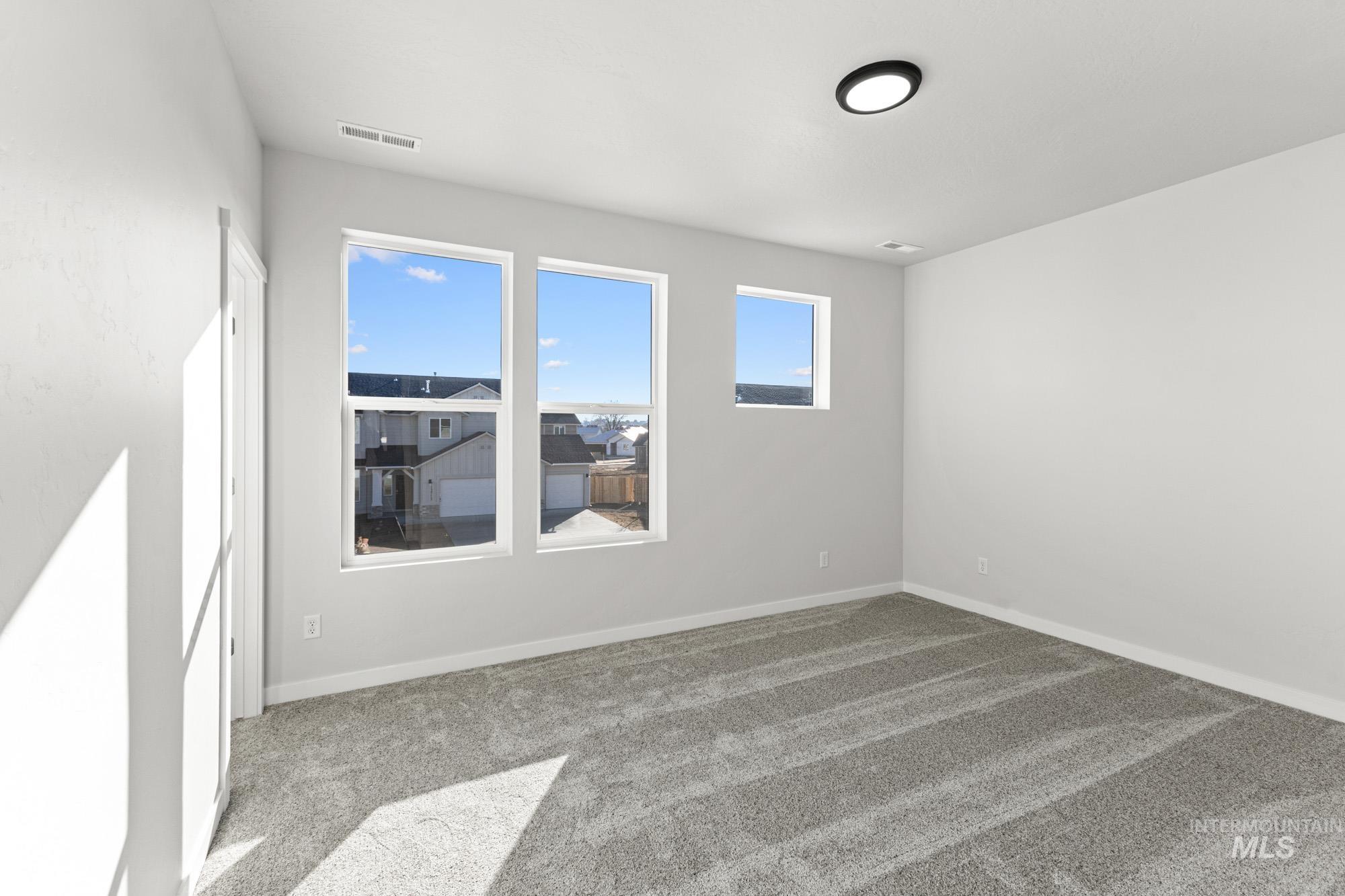13708 Judson Street Caldwell, ID 83607 - Photo 18 of 29 Carpeted spare room with baseboards