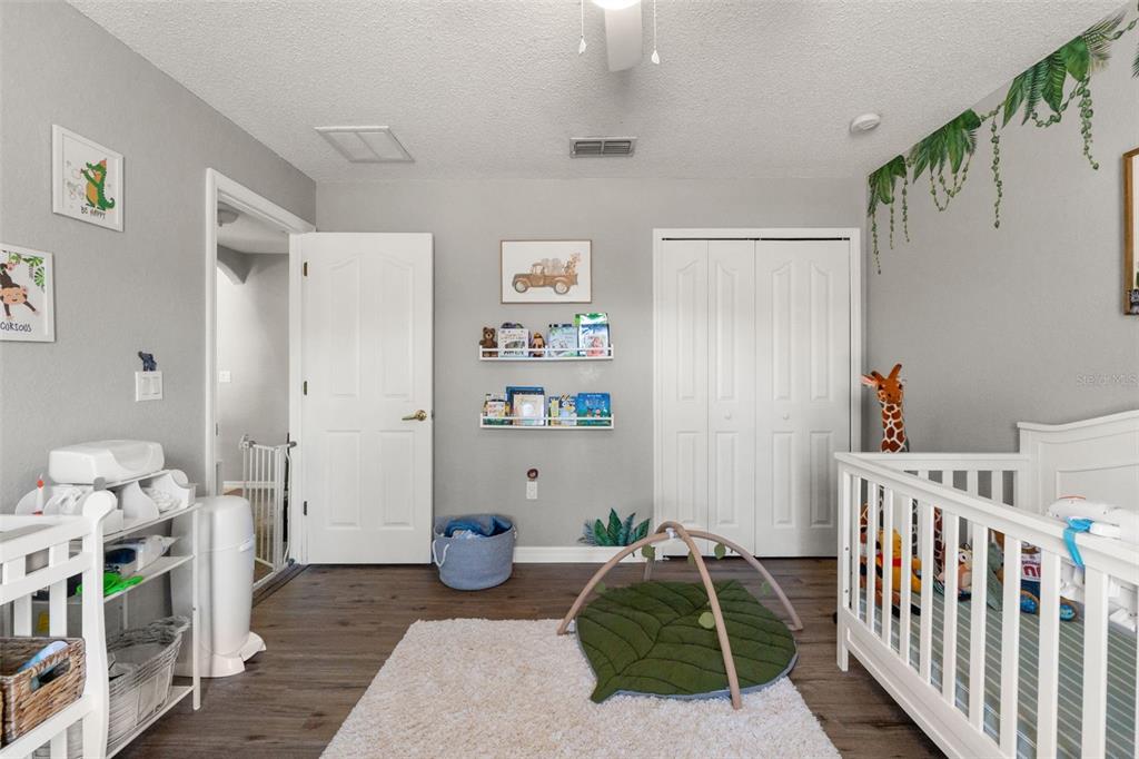 15335 Fleetwood Road Weeki Wachee, FL 34614 - Photo 27 of 40 a bedroom with furniture and a rug