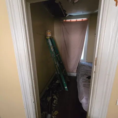 a bathroom with a granite countertop sink and a toilet