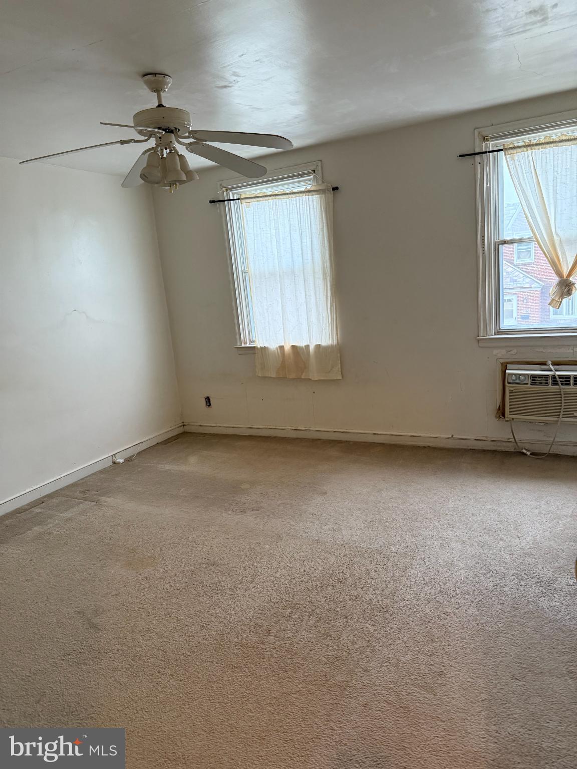 7151 Lynford Street Philadelphia, PA 19149 - Photo 10 of 13 an empty room with windows and cabinet