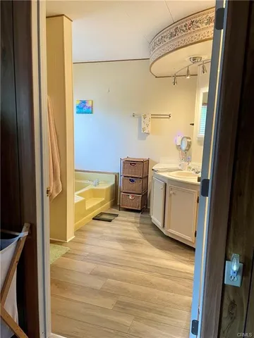 a bathroom with a sink a toilet and a shower