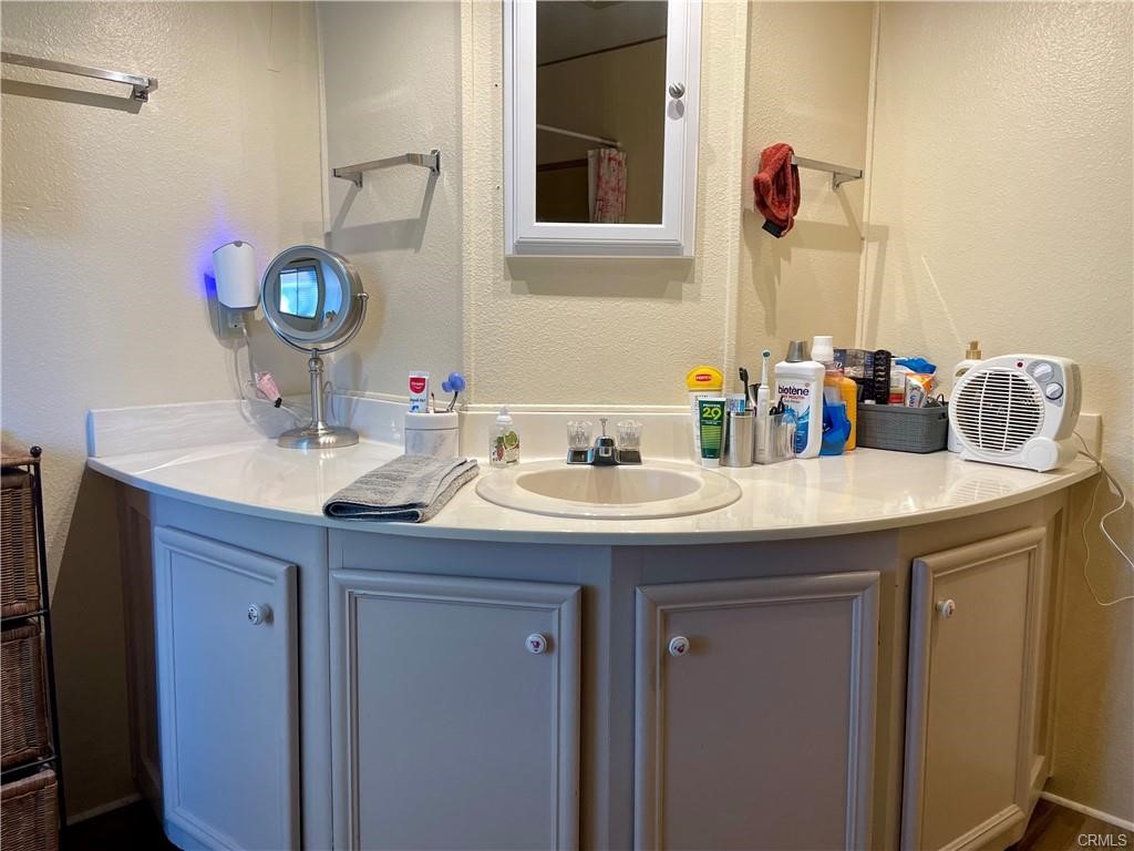 1901 Dayton Road, Unit 6 Chico, CA 95928 - Photo 14 of 16 a bathroom with a sink and a mirror