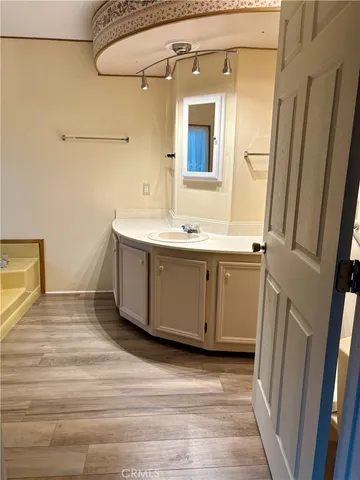 a bathroom with a tub and shower