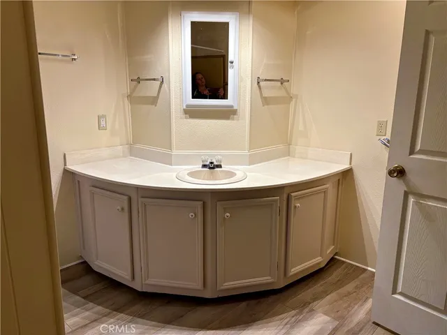 a kitchen with a stove a sink and a cabinets