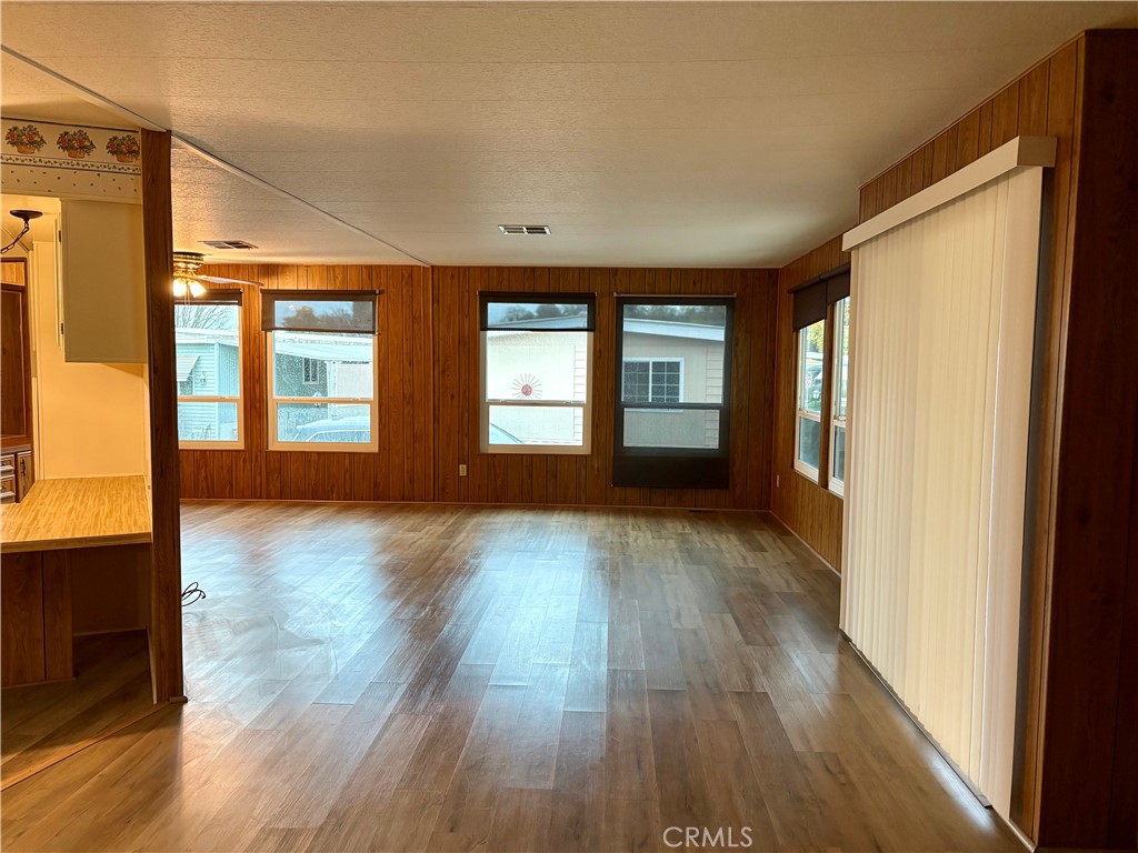 1901 Dayton Road, Unit 6 Chico, CA 95928 - Photo 4 of 25 a view of empty room with wooden floor and fan