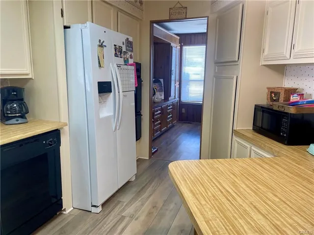 a kitchen with stainless steel appliances a refrigerator and a stove