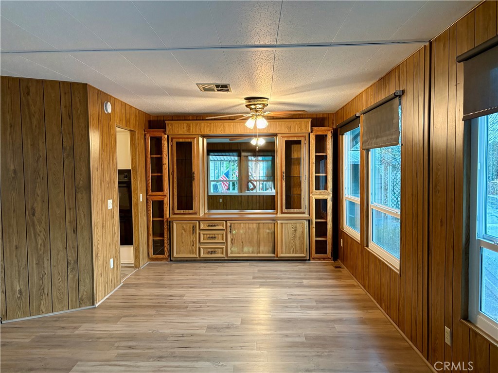 1901 Dayton Road, Unit 6 Chico, CA 95928 - Photo 7 of 25 a view of a hallway with wooden shelves
