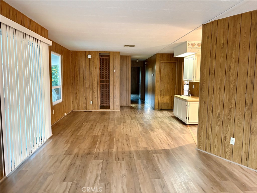 1901 Dayton Road, Unit 6 Chico, CA 95928 - Photo 8 of 25 a view of a big room with wooden floor and windows