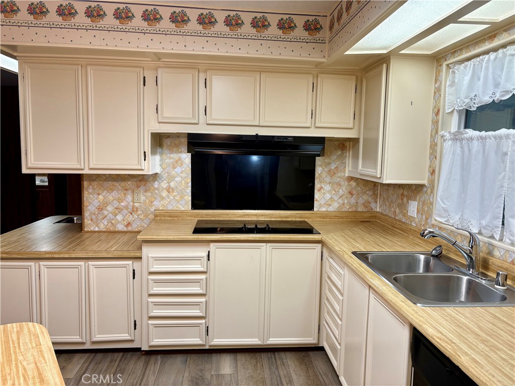 1901 Dayton Road, Unit 6 Chico, CA 95928 - Photo 10 of 25 a kitchen with granite countertop white cabinets and sink
