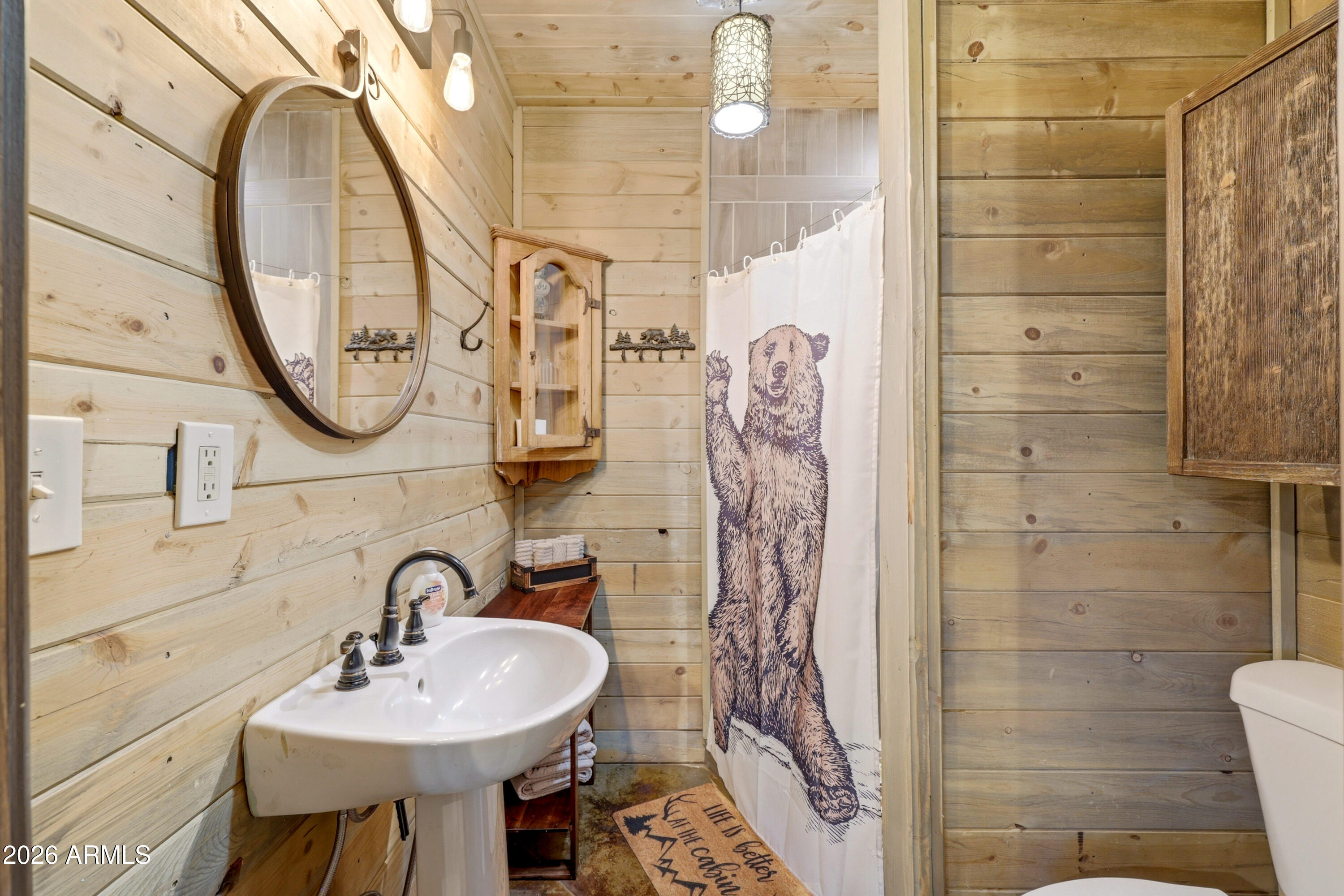 4971 Buck Springs Road Pinetop, AZ 85935 - Photo 13 of 32 a bathroom with a sink and a mirror