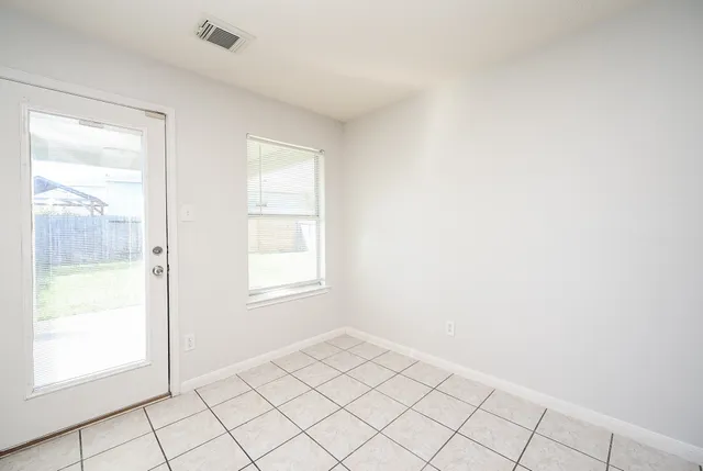 a view of an empty room and window