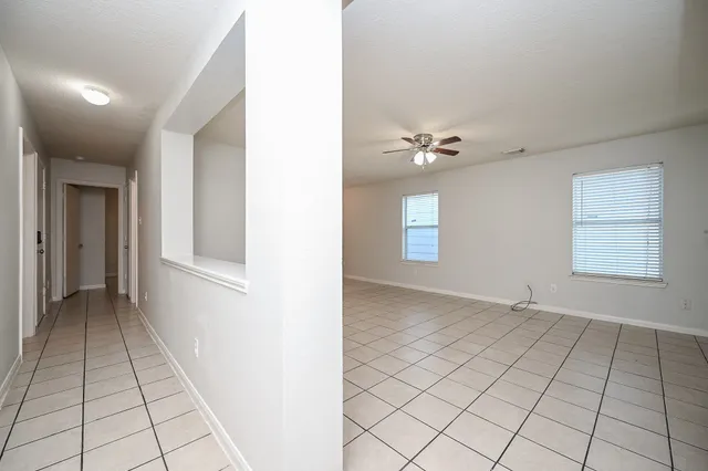 a view of an empty room and window