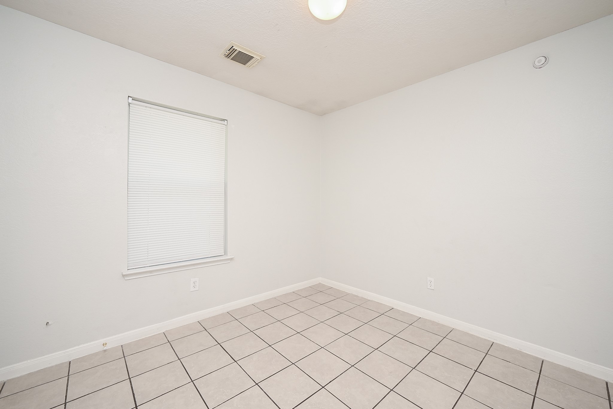 3635 Garrison Run Drive Spring, TX 77386 - Photo 25 of 32 Third bedroom leads to front view of the home.