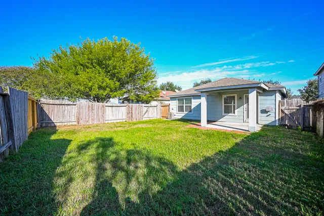 a front view of a house with yard porch and furniture
