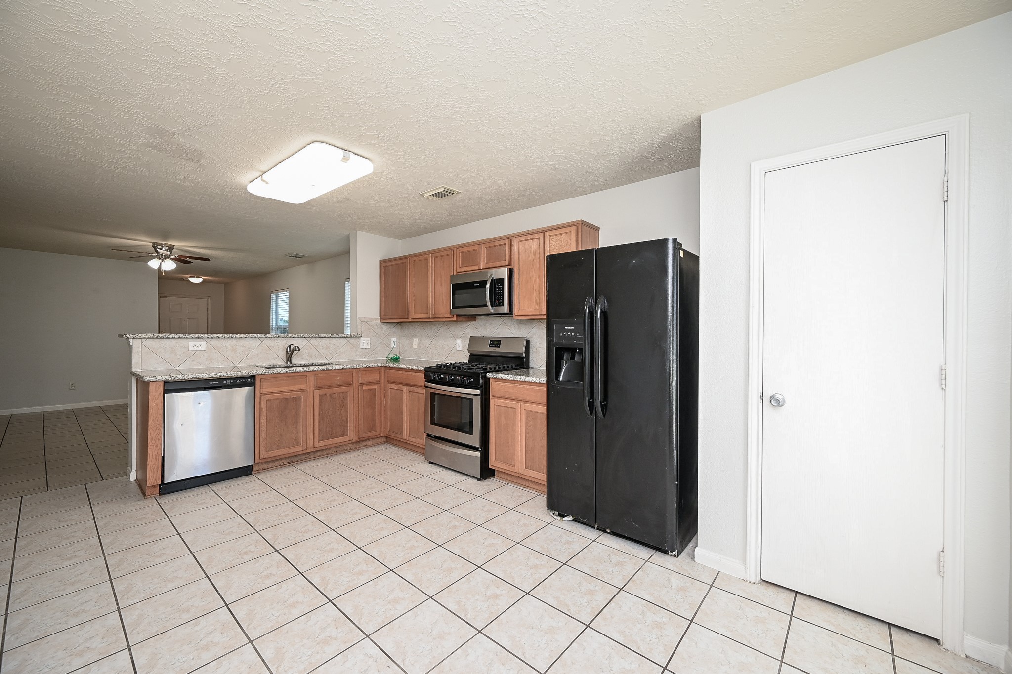 3635 Garrison Run Drive Spring, TX 77386 - Photo 8 of 32 Pantry nestled in between fridge and door that opens to backyard.