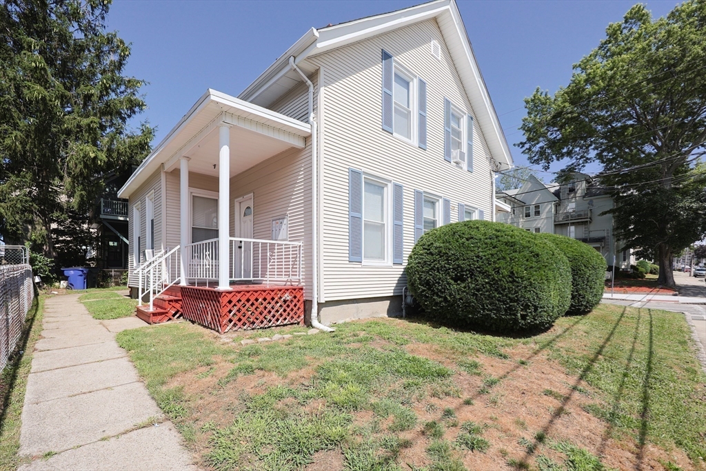 a front view of a house with garden