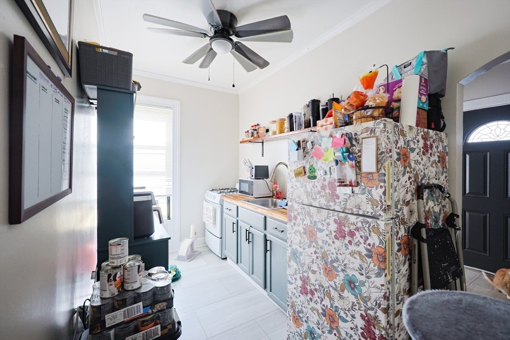 104 Grove Street Fall River, MA 02720 - Photo 11 of 37 a bed room with a bed furniture and a flat tv screen